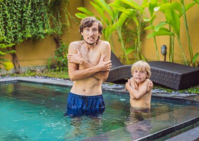 Dad and son acting like frozen in the pool
